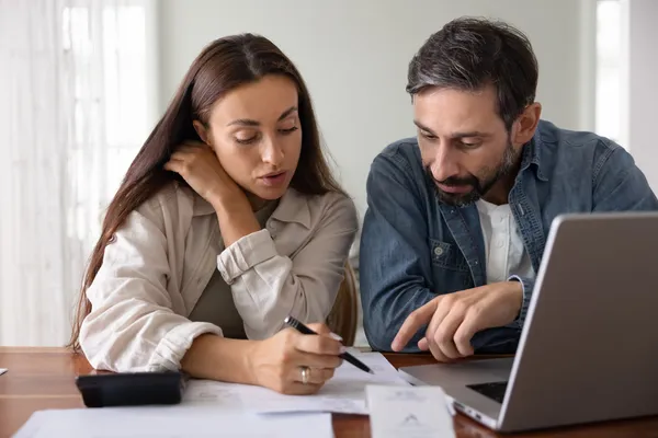 couple crunching numbers to see if they can afford ivf