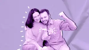 couple with positive pregnancy test celebrating