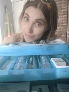 kelsey owens with a collection of ivf medications