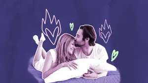 couple kissing in bed
