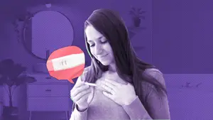 woman looking at a pregnancy test hoping for a successful pregnancy after chemical pregnancy