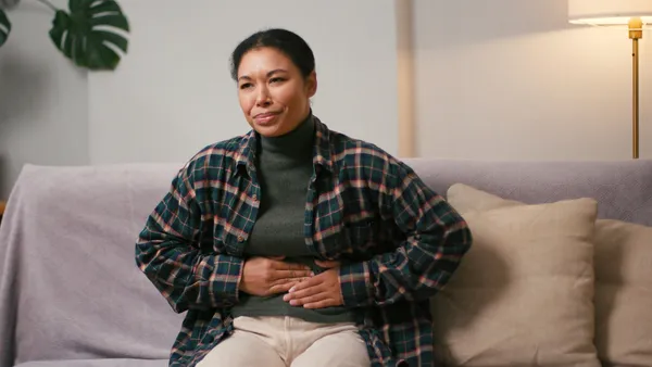 woman struggling with adenomyosis pain
