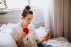 woman googling "anxiety" on her phone