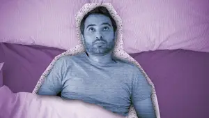 man lying in bed