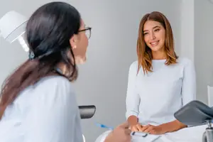 woman consulting with ob-gyn about how pcos affects egg freezing success