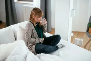 woman taking the postpartum depression pill