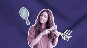 woman blow drying her hair