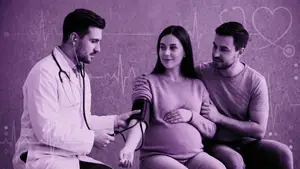 pregnant woman getting her blood pressure checked