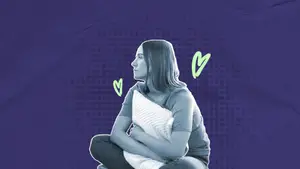 woman holding a pillow to her body