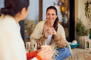 two women drinking tea and talking