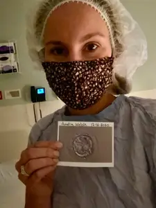 fertility entrepreneur suzie welsh holding a photo of her embryo