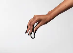 woman squeezing a flex menstrual disc