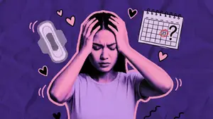 woman using a period tracker on her phone