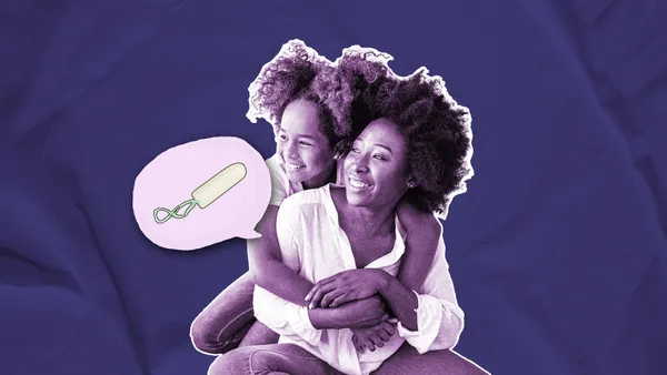 mom and daughter embracing and talking about periods