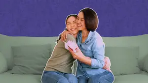 friend-hugging-friend-with-gift