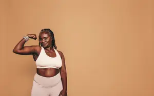 strong middle-aged woman flexing her bicep