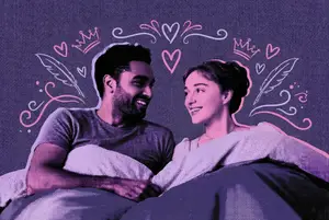 couple in bed watching bridgerton