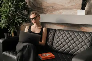 woman working on the sofa in her office