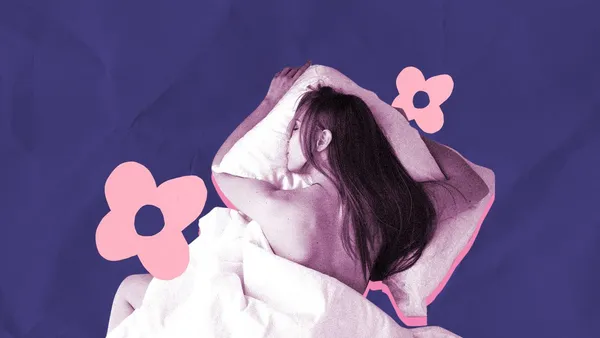 woman in a prone position in bed