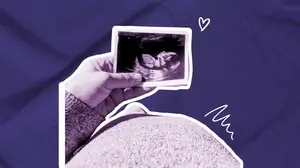 pregnant woman staring down at her ultrasound image