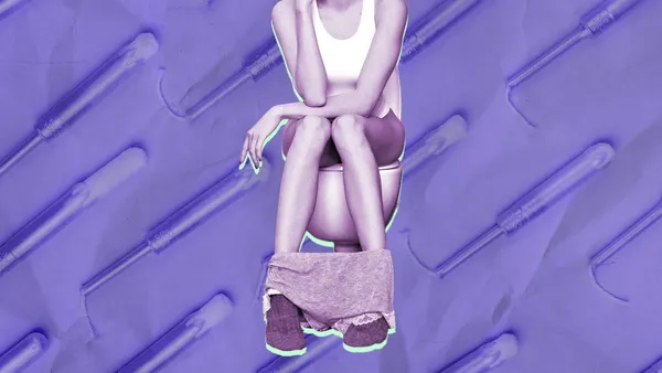 woman on the toilet wondering can you poop with a tampon in