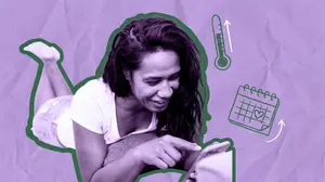 woman tracking ovulation with an app on her phone