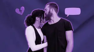 man kissing woman on the forehead