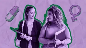 two female college students walking on campus