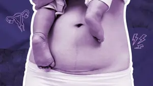 woman holding her baby postpartum