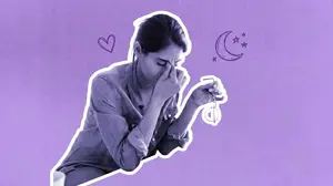 mentally exhausted woman hunched over her computer