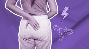 woman experiencing butt cramps during her period