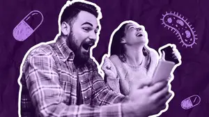 couple laughing as they're scrolling memes