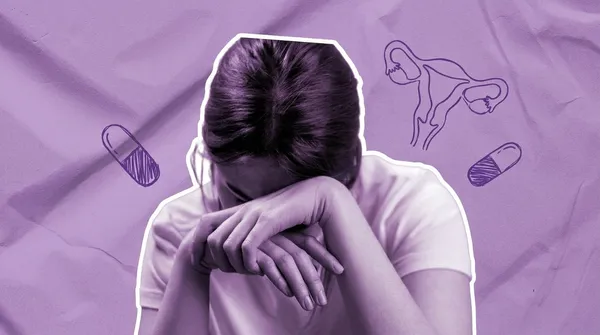 woman head down in distress due to miscarriage