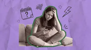 woman using a period tracker on her phone
