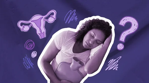 woman using a hot water bottle for period cramps