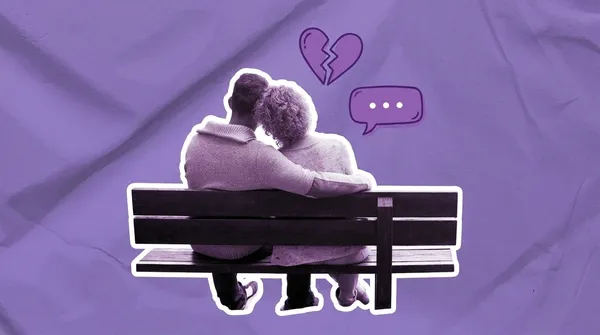 couple on a bench staring at a lake